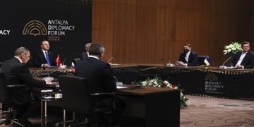 In this photo provided by Turkish Foreign Ministry, Turkish Foreign Minister Mevlut Cavusoglu, top left, chairs a tripartite meeting with Russia's Foreign Minister Sergey Lavrov, left, and Ukraine's Foreign Minister Dmytro Kuleba, right, in Antalya, Turkey, Thursday, March 10, 2022. (Cem Ozdel/Turkish Foreign Ministry via AP)