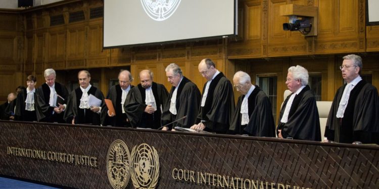 Judges of the International Court of Justice arrive in the courtroom during the first day of the witnesses in the Croatia vs. Serbia case in the Peace Palace in The Hague, The Netherlands, on March 2014. Croatia accuses neighbouring country Serbia of committing genocide in the nineties at the breakup of Yugoslavia. AFP PHOTO/ANP BART MAAT netherlands out        (Photo credit should read BART MAAT/AFP/Getty Images)
